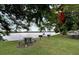 Waterfront picnic area with grills and shaded tables at 611 Destiny Dr # 216, Ruskin, FL 33570
