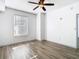 Hardwood floor bedroom with large window and ceiling fan at 700 S Harbour Island Blvd # 516, Tampa, FL 33602