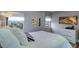 Bedroom with hardwood floors and white bedding at 841 4Th Avenue N # 67, St Petersburg, FL 33701
