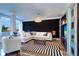Spacious living room with a white sectional sofa and black accent wall at 841 4Th Avenue N # 67, St Petersburg, FL 33701