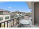 Outdoor balcony with table and chairs, offering city views at 8709 Palm Ranches Pl, Tampa, FL 33614