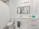 Clean bathroom with white vanity and a shower/tub combo at 8709 Palm Ranches Pl, Tampa, FL 33614