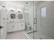 Modern bathroom with double vanity, large shower, and updated fixtures at 8709 Palm Ranches Pl, Tampa, FL 33614
