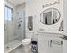 Clean bathroom with a walk-in shower and white vanity at 8709 Palm Ranches Pl, Tampa, FL 33614