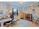 Cozy bedroom with home office setup and gallery wall at 8709 Palm Ranches Pl, Tampa, FL 33614