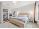 Bright bedroom with king-size bed, built in bookshelves and large windows at 8709 Palm Ranches Pl, Tampa, FL 33614