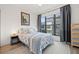 Bright bedroom with a queen-size bed and large window at 8709 Palm Ranches Pl, Tampa, FL 33614