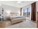 Spacious bedroom with a wooden bed frame and built-in bookshelves at 8709 Palm Ranches Pl, Tampa, FL 33614