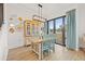Charming dining area with a light-colored table and a view of the backyard at 8709 Palm Ranches Pl, Tampa, FL 33614