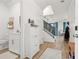 Bright and airy entryway with half bathroom and staircase at 8709 Palm Ranches Pl, Tampa, FL 33614