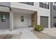 Front view of townhome with a gray and white color scheme at 8709 Palm Ranches Pl, Tampa, FL 33614