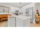 Modern kitchen with white cabinets, stainless steel appliances, and island at 8709 Palm Ranches Pl, Tampa, FL 33614