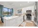 Modern kitchen with white cabinets, stainless steel appliances, and island at 8709 Palm Ranches Pl, Tampa, FL 33614