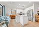 Modern kitchen with white cabinets, stainless steel appliances, and island at 8709 Palm Ranches Pl, Tampa, FL 33614
