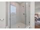 Large walk-in shower with glass enclosure and gray tile at 8709 Palm Ranches Pl, Tampa, FL 33614