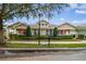 Two-story craftsman style home with porch and landscaping at 10002 Bentley Way, Tampa, FL 33626