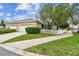 Two-car garage and nicely landscaped front yard at 10002 Bentley Way, Tampa, FL 33626