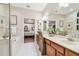 Double vanity bathroom with a soaking tub and a walk-in shower at 10002 Bentley Way, Tampa, FL 33626