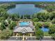 Stunning aerial view of community amenities and lakefront at 11550 Biddeford Pl, New Port Richey, FL 34654