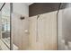 Clean bathroom with shower stall and tiled walls at 11550 Biddeford Pl, New Port Richey, FL 34654