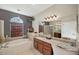 Luxurious bathroom with a large soaking tub, granite vanity, and walk-in shower at 11550 Biddeford Pl, New Port Richey, FL 34654