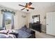 Bedroom with a queen-size bed and ceiling fan at 11550 Biddeford Pl, New Port Richey, FL 34654