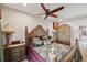 Elegant bedroom with a king-size bed, wooden furniture, and access to a private bathroom at 11550 Biddeford Pl, New Port Richey, FL 34654