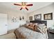 King-size bed, ceiling fan, and neutral wall colors at 11550 Biddeford Pl, New Port Richey, FL 34654