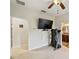 Bonus room with a large TV and treadmill at 11550 Biddeford Pl, New Port Richey, FL 34654