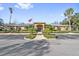 Community center with flag and landscaping at 11550 Biddeford Pl, New Port Richey, FL 34654