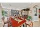 Elegant dining room with a large wood table and antique china cabinet at 11550 Biddeford Pl, New Port Richey, FL 34654