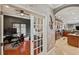 Home office features built-in shelving and hardwood floors at 11550 Biddeford Pl, New Port Richey, FL 34654