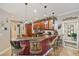 Kitchen features an island and dark wood cabinets at 11550 Biddeford Pl, New Port Richey, FL 34654