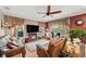 Comfortable living room with leather sofas and a fireplace at 11550 Biddeford Pl, New Port Richey, FL 34654
