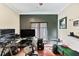 Home office with a large desk, comfortable chair, and window at 11550 Biddeford Pl, New Port Richey, FL 34654