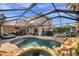 Large screened pool and spa with a patio at 11550 Biddeford Pl, New Port Richey, FL 34654