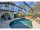 Enclosed pool area with spa and patio furniture at 11550 Biddeford Pl, New Port Richey, FL 34654