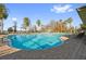 Community pool with a water slide and plenty of lounge chairs at 11550 Biddeford Pl, New Port Richey, FL 34654
