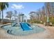 Interactive splash pad with a slide for to enjoy at 11550 Biddeford Pl, New Port Richey, FL 34654