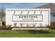 Sunstone Wellen Park community entrance sign with white brick and landscaping at 12199 Meditation Trl, Venice, FL 34293