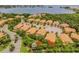 Aerial view of Banyan Bay community, showing lakefront location and numerous townhouses at 130 Banyan Bay Dr, St Petersburg, FL 33705