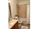 Simple bathroom with single vanity, bathtub and shower at 130 Banyan Bay Dr, St Petersburg, FL 33705