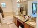 Elegant bathroom with dual vanities, soaking tub and separate shower at 130 Banyan Bay Dr, St Petersburg, FL 33705