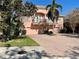 Two-story townhouse with balcony, two-car garage, and brick driveway at 130 Banyan Bay Dr, St Petersburg, FL 33705