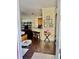 Open living room with dark hardwood floors and kitchen bar at 130 Banyan Bay Dr, St Petersburg, FL 33705