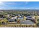 Aerial view of apartment community with pool and lake at 1400 Gandy N Blvd # 202, St Petersburg, FL 33702