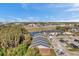 Aerial view of apartment buildings, parking lot, and surrounding landscape at 1400 Gandy N Blvd # 202, St Petersburg, FL 33702