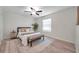 Bright bedroom with a queen-size bed and a ceiling fan at 1400 Gandy N Blvd # 202, St Petersburg, FL 33702