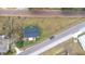 House shown in a wide aerial view of neighborhood at 14430 10Th. St, Dade City, FL 33523