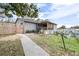 House with a fenced backyard, hammock, and walkway at 14430 10Th. St, Dade City, FL 33523